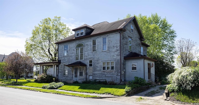 view of side of property with a yard