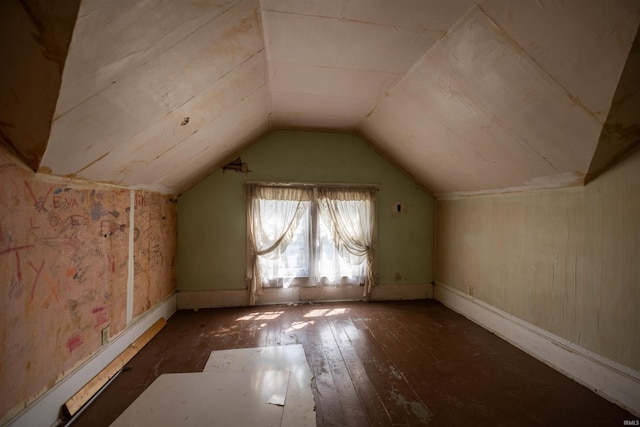 bonus room with vaulted ceiling and wood-type flooring