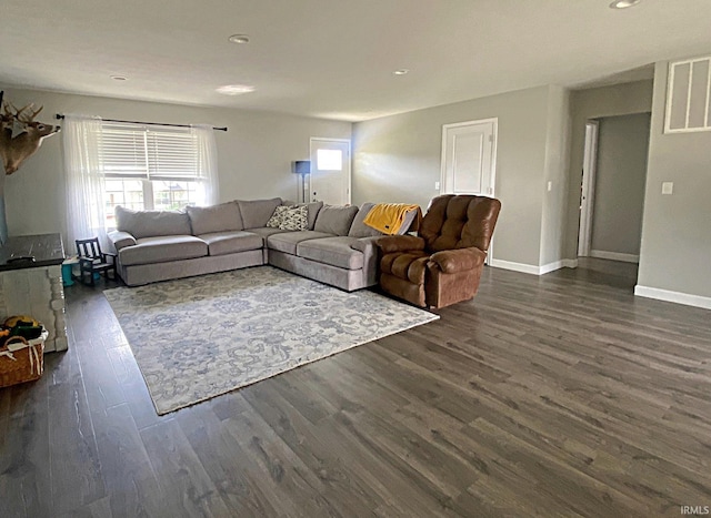 living room featuring dark wood-type flooring