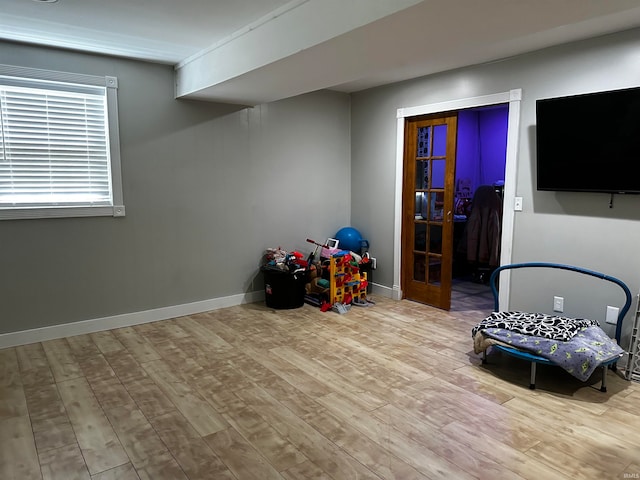 recreation room with light hardwood / wood-style floors