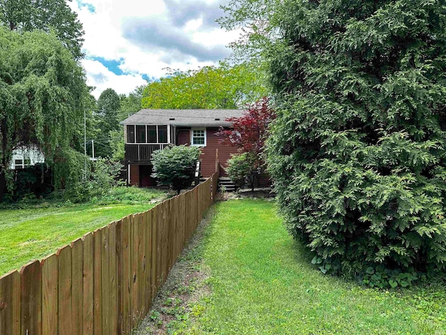 view of yard with a sunroom