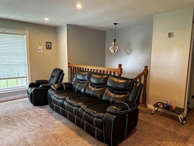 cinema room with carpet floors, recessed lighting, a textured ceiling, and baseboards