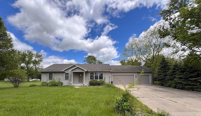 ranch-style house featuring a garage and a front lawn