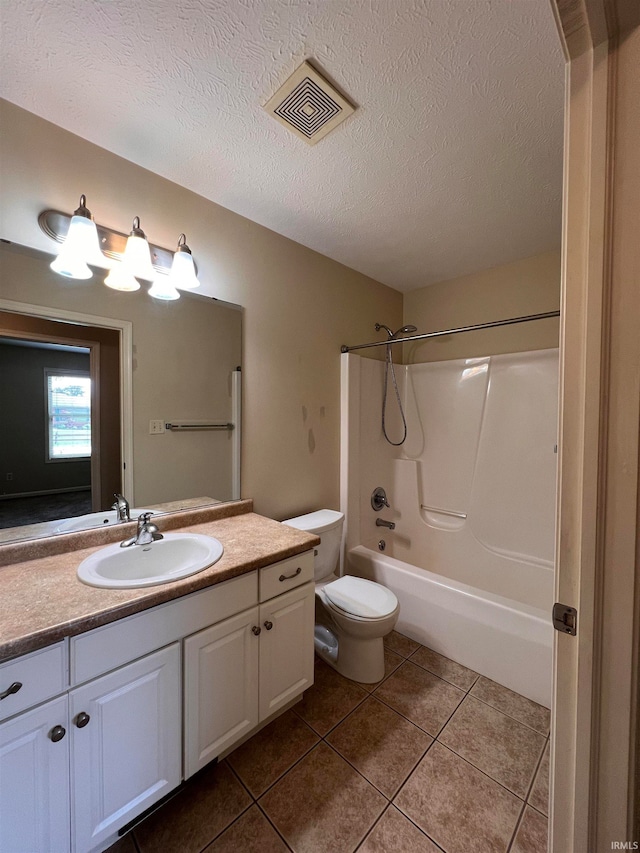 full bathroom with toilet, a textured ceiling, vanity, tile floors, and  shower combination