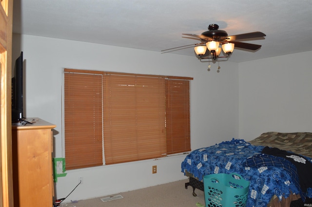 bedroom featuring ceiling fan and carpet flooring