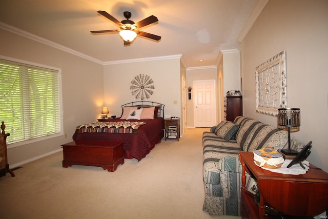 carpeted bedroom with ceiling fan and crown molding