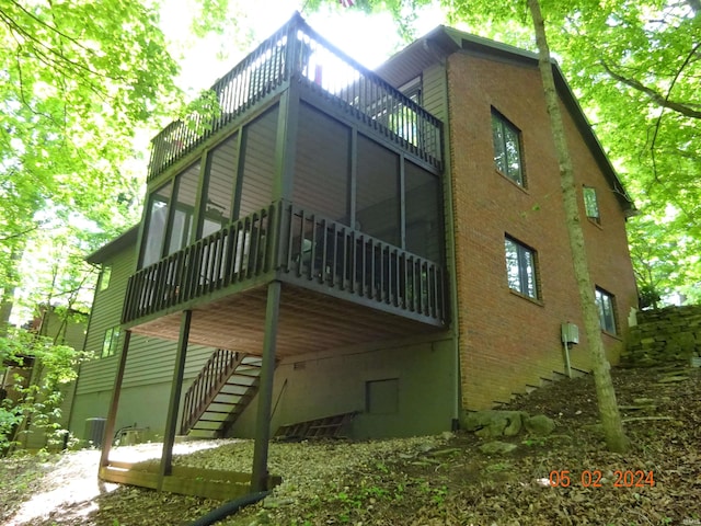 view of home's exterior featuring a sunroom