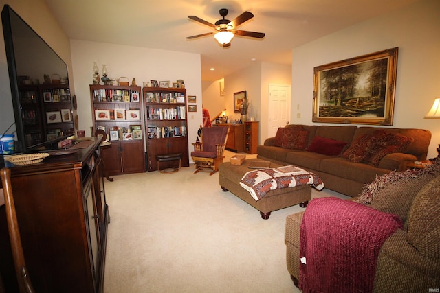 carpeted living room with ceiling fan