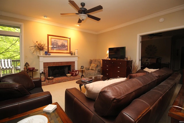 living room with crown molding, a fireplace, and ceiling fan