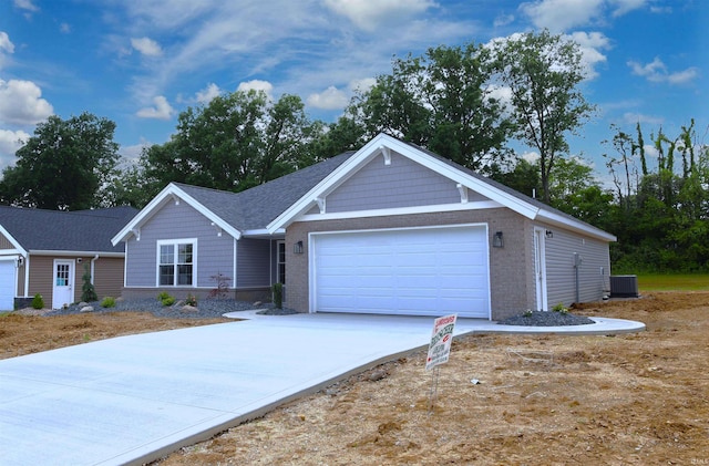 single story home with a garage and central air condition unit