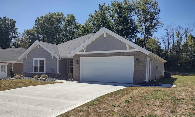 view of front of house with a garage, a front lawn, and central AC unit