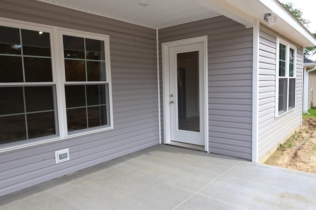 doorway to property featuring a patio