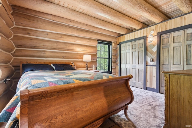 bedroom with beamed ceiling, log walls, and wooden ceiling