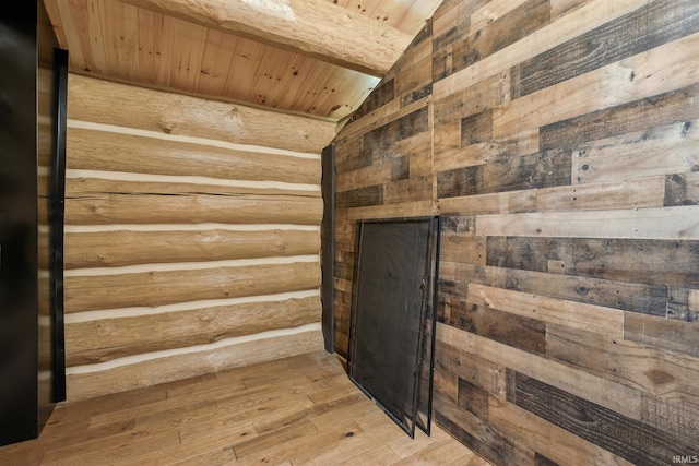 view of sauna / steam room with hardwood / wood-style flooring, wood ceiling, and wooden walls