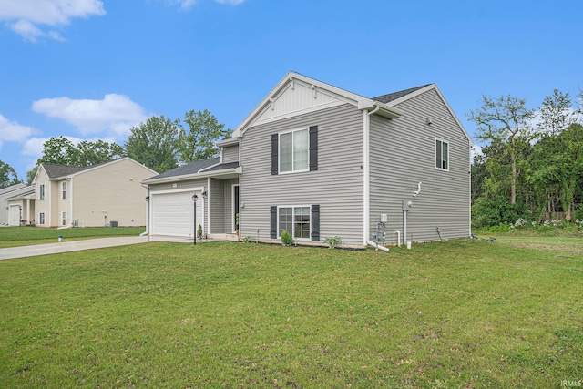 view of front facade featuring a garage and a front lawn