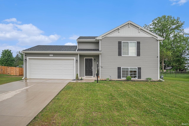 view of front of property with a garage and a front yard