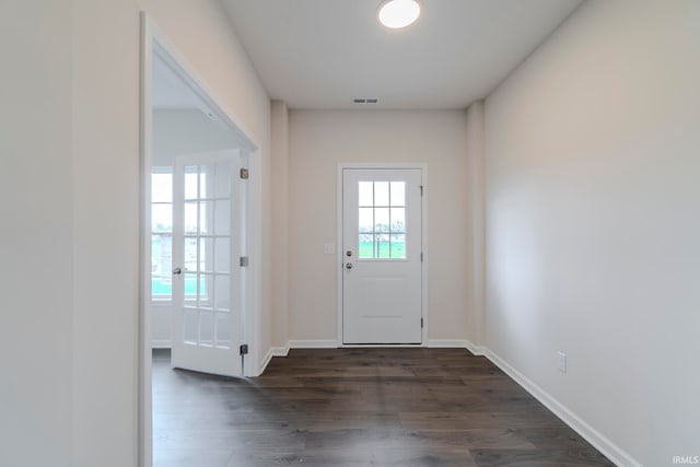 doorway to outside with dark hardwood / wood-style flooring