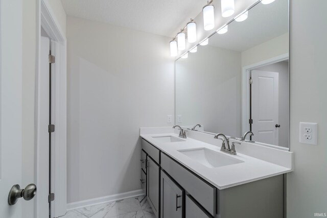 bathroom with tile floors and double sink vanity