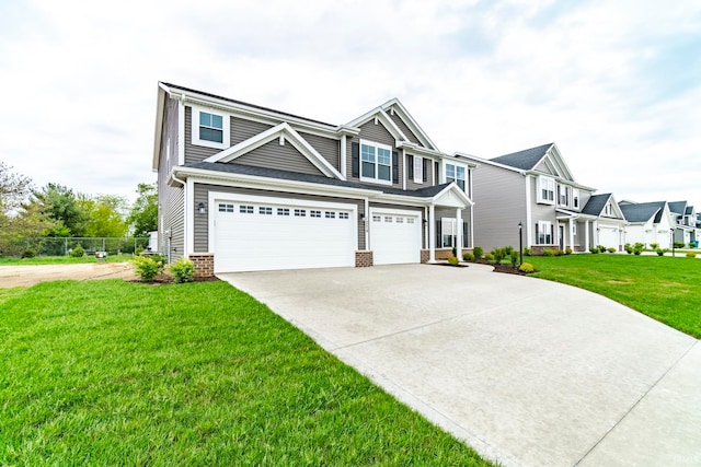 view of front of property with a front lawn and a garage