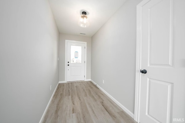 entryway with light hardwood / wood-style floors