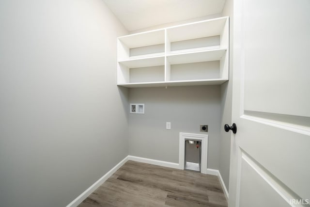 washroom with wood-type flooring, hookup for an electric dryer, and washer hookup