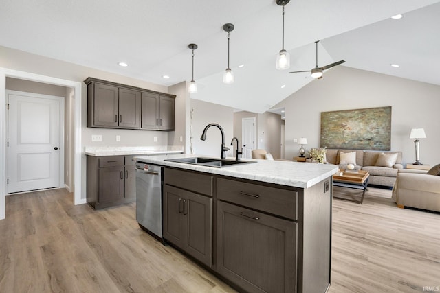 1016 Bryce Cir, Ligonier, IN 46767 - kitchen featuring stainless steel dishwasher, a sink, dark brown cabinets, vaulted ceiling, and light countertops