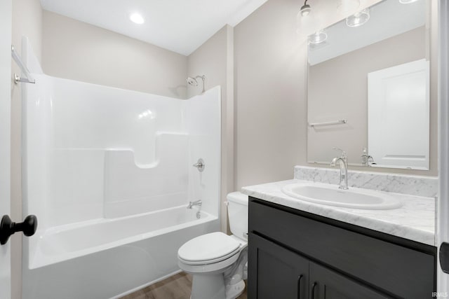 1016 Bryce Cir, Ligonier, IN 46767 - bathroom featuring wood finished floors, toilet, vanity, and bathing tub / shower combination