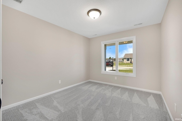 1016 Bryce Cir, Ligonier, IN 46767 - empty room featuring visible vents, baseboards, and carpet flooring
