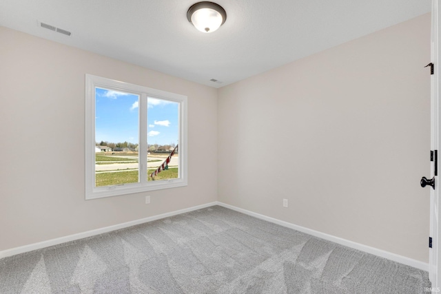 1016 Bryce Cir, Ligonier, IN 46767 - carpeted spare room featuring baseboards and visible vents