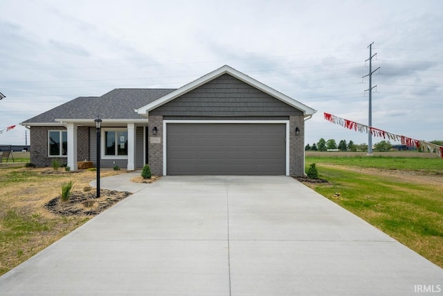 single story home featuring a front yard and a garage