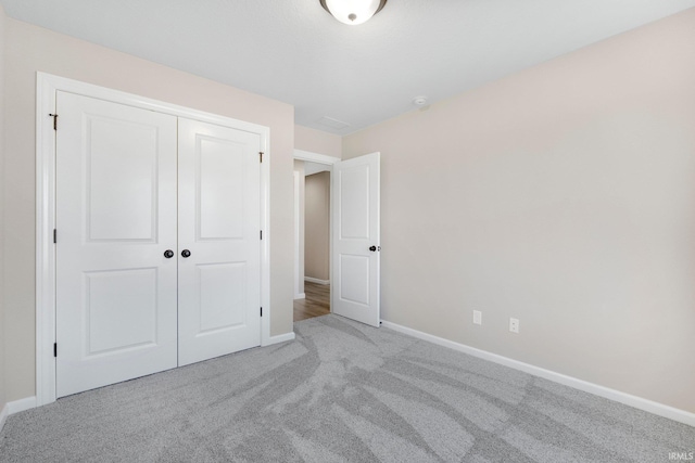 1016 Bryce Cir, Ligonier, IN 46767 - unfurnished bedroom with a closet, carpet flooring, and baseboards