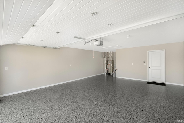 1016 Bryce Cir, Ligonier, IN 46767 - garage with baseboards and a garage door opener