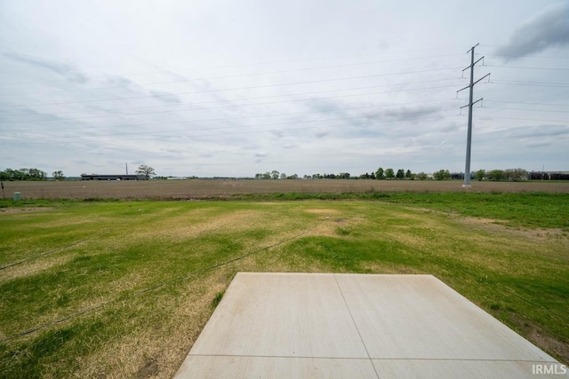 view of yard with a rural view