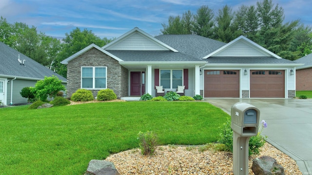 view of front of house featuring a front yard and a garage