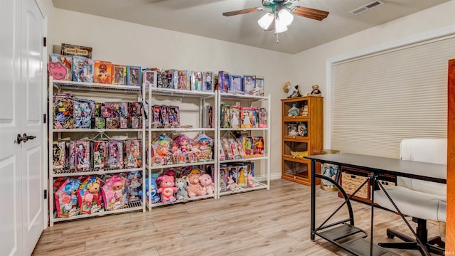 office space featuring ceiling fan and hardwood / wood-style flooring