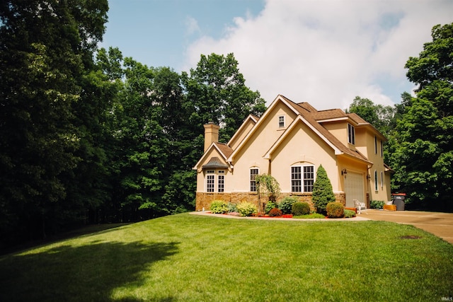 5105 E Earl Young Rd, Bloomington, IN 47408 - view of front facade with a garage and a front yard