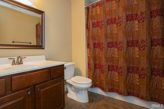 full bathroom featuring tile flooring, shower / bath combination with curtain, vanity, and toilet