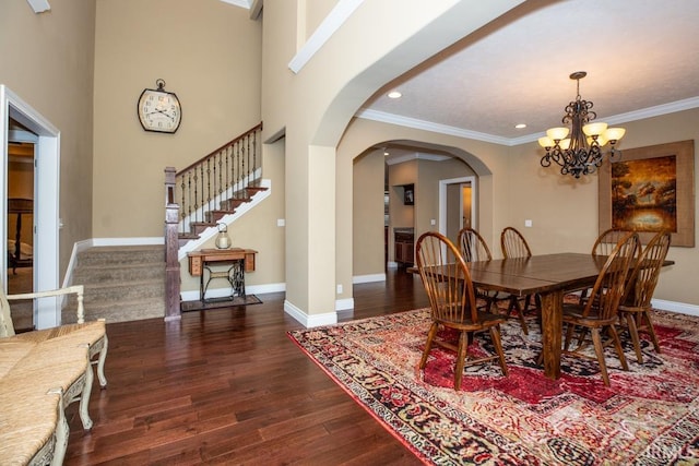 dining room with a notable chandelier, dark hardwood / wood-style floors, and crown molding