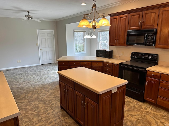 kitchen with decorative light fixtures, tile flooring, black appliances, and crown molding