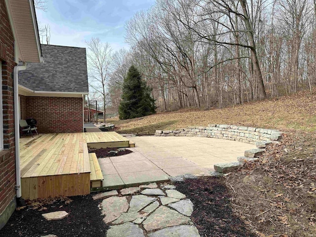 view of yard with a wooden deck