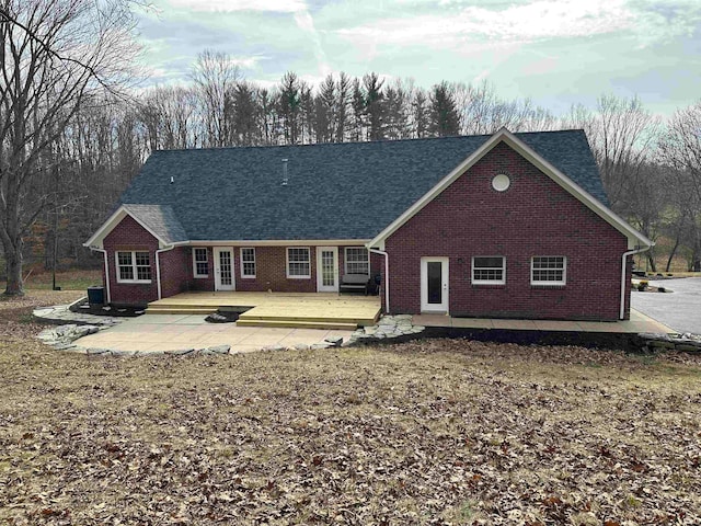 back of house featuring a wooden deck