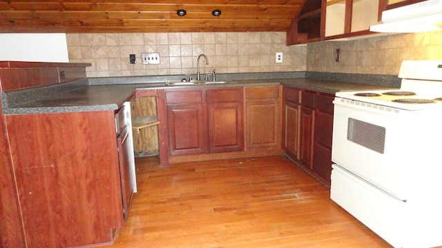 kitchen featuring decorative backsplash, light wood-type flooring, white range oven, exhaust hood, and sink