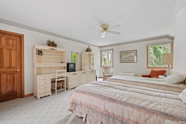 bedroom with light carpet, ornamental molding, and ceiling fan