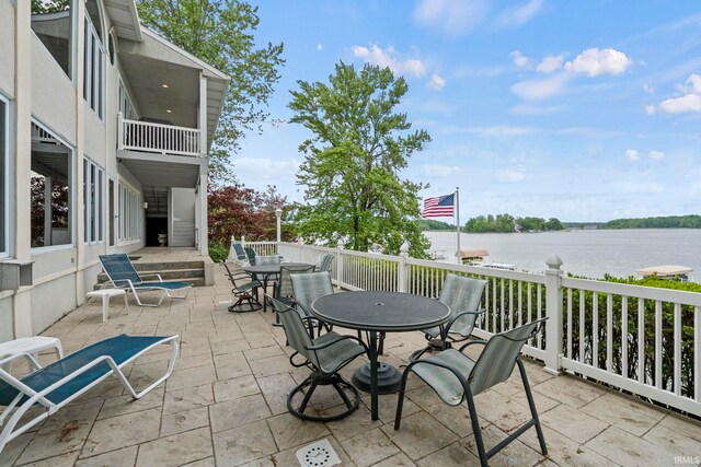 view of patio with a water view