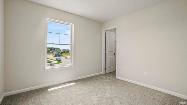 empty room with carpet flooring