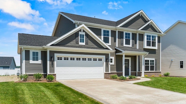 craftsman-style house featuring a front yard and a garage