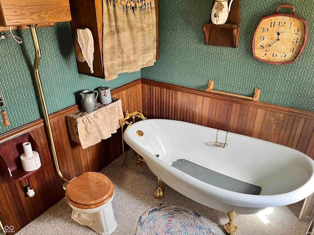 bathroom with a bathing tub and toilet