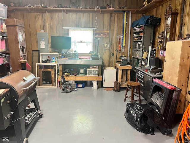 interior space featuring wood walls and a workshop area