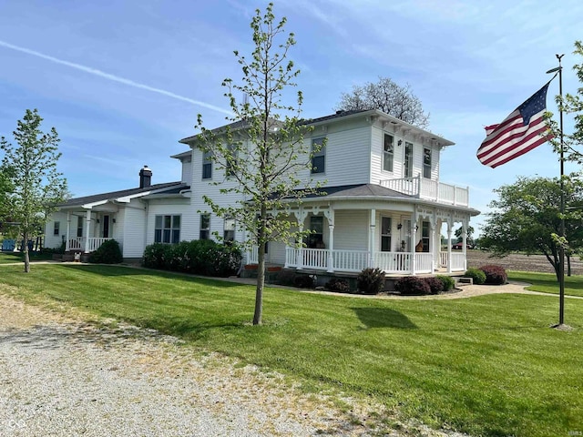 view of front facade featuring a front yard and a porch