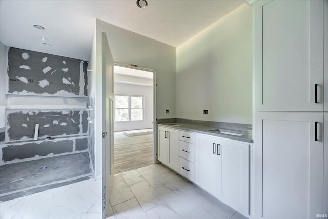 bathroom with vanity and hardwood / wood-style floors